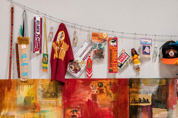 With a twist of dry humor, the artist added, above her monumental painting, objects depicting Native stereotypes.